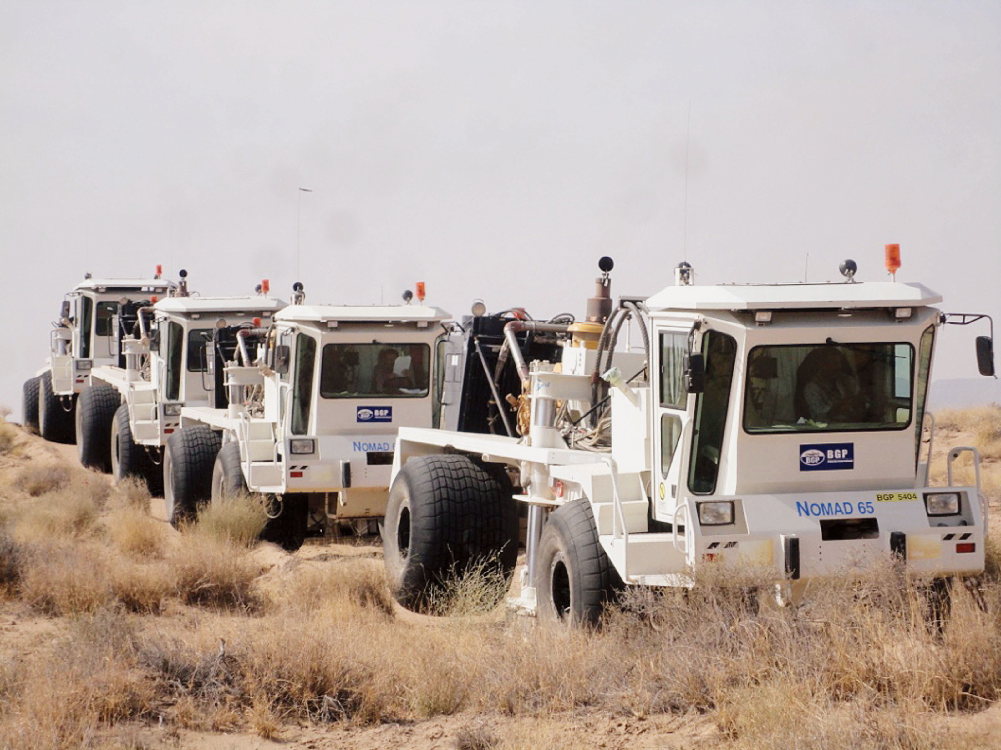 Vibrators on seismic line at Sui Gas Field Balochistan