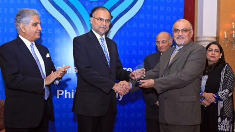 MD and CEO PPL Syed Wamiq Bokhari (second right) receives the Corporate Philanthropy Award from Federal Minister for Planning Development and Reforms Professor Ahsan Iqbal. Pakistan Centre for Philanthropys Chairman Board of Directors Zaffar A. Khan former Chairman Dr. Shamsh Kassim Lakha and Executive Director Shazia Maqsood Amjad (first third and fifth left) are also present. PPL was declared the largest corporate giver by volume of donations for 2013 and 2014 at the Corporate Philanthropy Awards hosted b