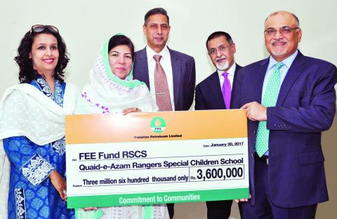 (right to left) MD and CEO PPL Syed Wamiq Bokhari presenting the donation cheque to Principal Rangers Special Children School Zahida Jalees (fourth right) in the presence of officials from both organizations