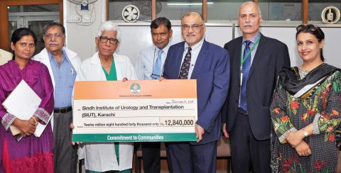 MD and CEO PPL Syed Wamiq Bokhari (third right) presents donation cheque to Director SIUT Dr. Syed Adibul Hasan Rizvi (fifth right) on December 4 2017 for a 10-bed dialysis unit at SIUT s satellite centre Mehrunnisa Hospital in the presence of staff from both organizations