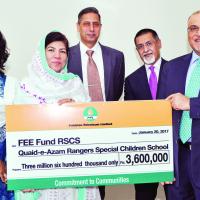 (right to left) MD and CEO PPL Syed Wamiq Bokhari presenting the donation cheque to Principal Rangers Special Children School Zahida Jalees (fourth right) in the presence of officials from both organizations
