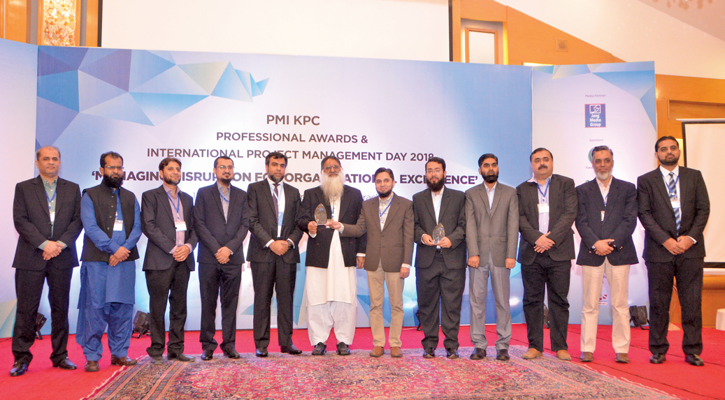 DMD (TS) Dr. Fareed Iqbal Siddiqui and Project Management Institute (PMI) Karachi Pakistan Chapter (KPC) 's President Fahad Ahmed (seventh and eight right) with PPL’s PMI members. PPL received Project Management Award 2018 for Corporate Excellence 