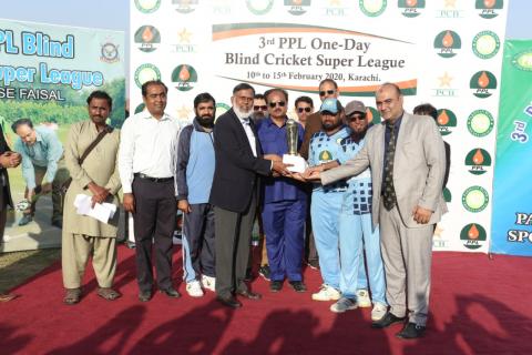 Winning Captain of team Sindh Nasir Ali is receiving 3rd PPL Blind Cricket Super League trophy from chief guest DMD PPL Khalid Raza and Chairman PBCC Syed Sultan Shah at the closing ceremony on February 15 at PAF Faisal Airbase Ground  Karachi