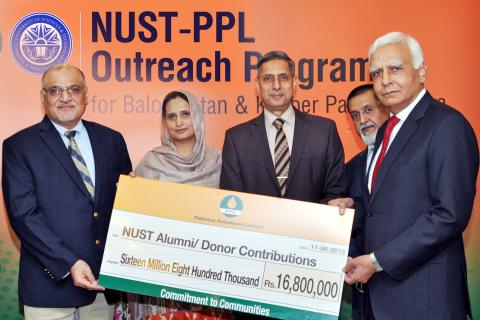 MD and CEO Pakistan Petroleum Limited (PPL) Syed Wamiq Bokhari (first left) presents the donation cheque to Pro Rector Academics National University of Sciences and Technology (NUST) Air Vice Marshall Dr. Asif Raza (first right) at PPL head office. General Manager University Advancement Office NUST Maria Qadri (second left) is also present on the occasion. PPL donation of Rs. 16.8 million will be used under the mutual NUST-PPL Outreach Programme to provide training to about 320 students from Balochistan and