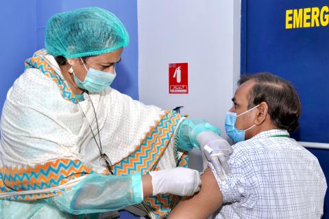 CanSinoBio vaccine being administered to a staffer at PPL head office in Karachi 